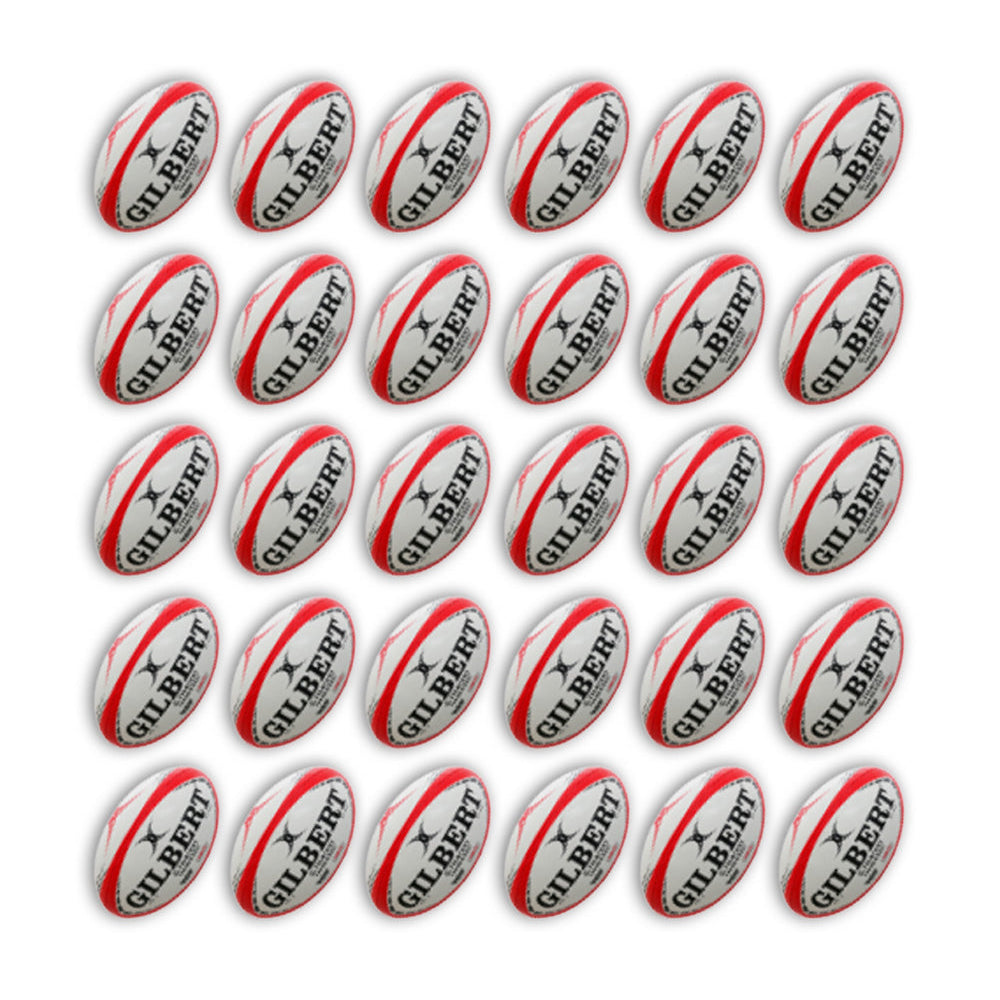 Close-up of Gilbert G-TR4000 trainer rugby balls in team colors stacked inside two large breathable ball bags for training use