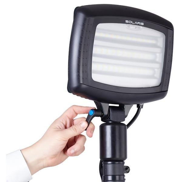 Nightsearcher Solaris Megastar 20K LED rechargeable floodlight shown mounted, spotlighting outdoor sports field at night