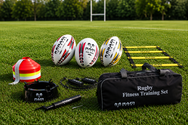 RAM rugby fitness training set with balls, cones and agility ladder on a pitch