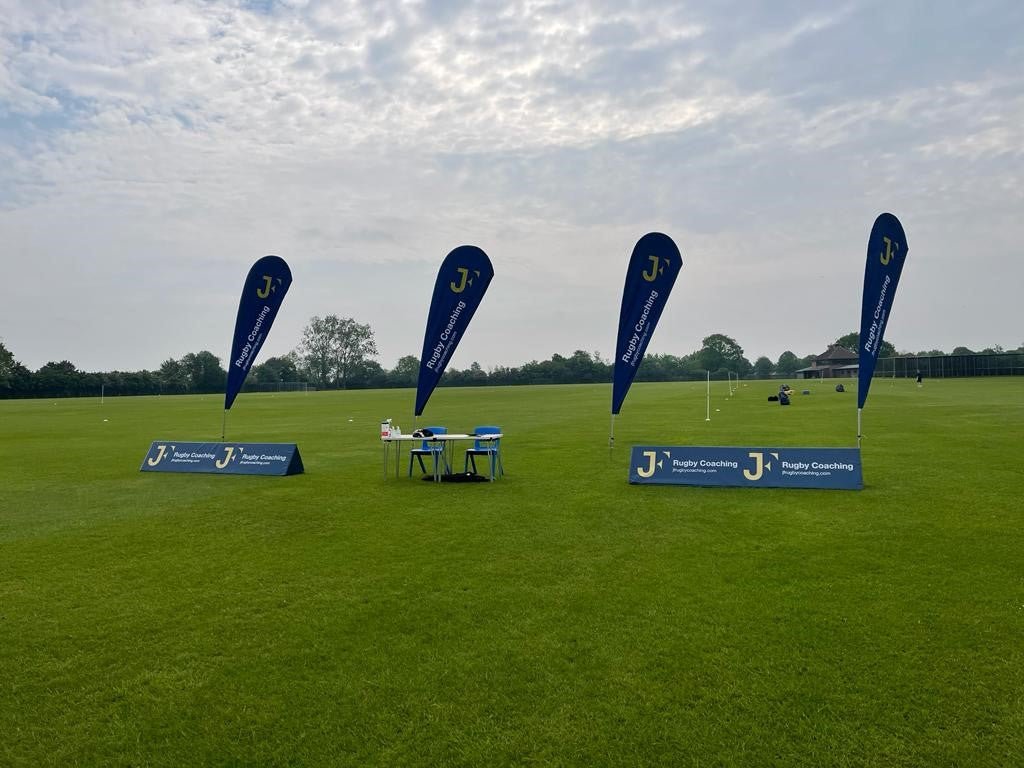 Ram Rugby custom double-sided feather corner flags in vibrant colors, designed for outdoor sports and event branding.