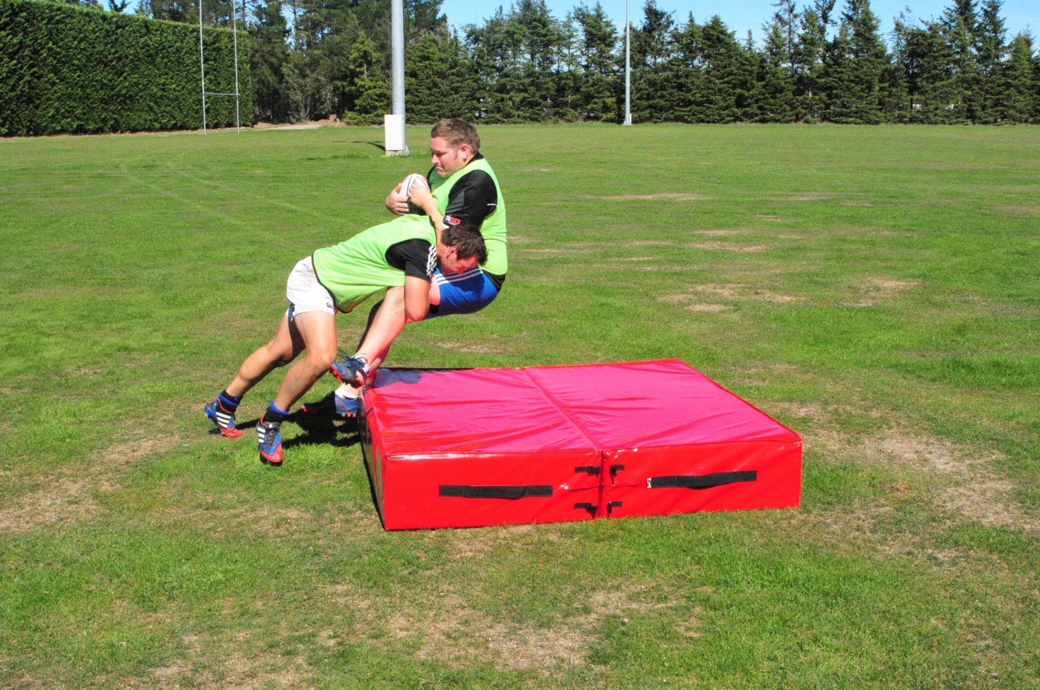 Ram Rugby durable custom tackling mat with printed logo, reinforced PVC base, foldable design for wrestling and crash drills